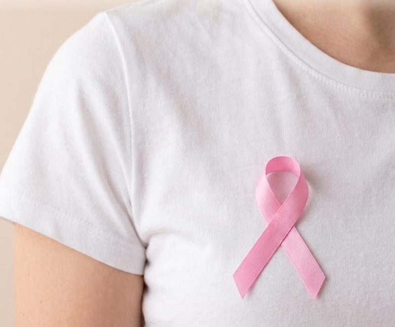 Breast cancer awareness — a woman wearing a pink ribbon